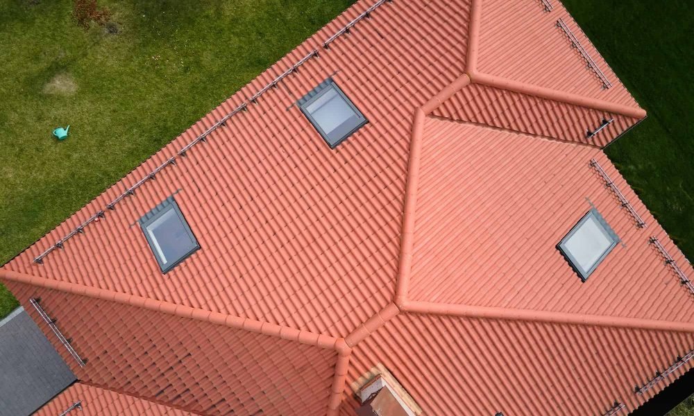 closeup-of-attic-windows-on-house-roof-top-covered-with-ceramic-shingles-tiled-covering-of-building.jpg