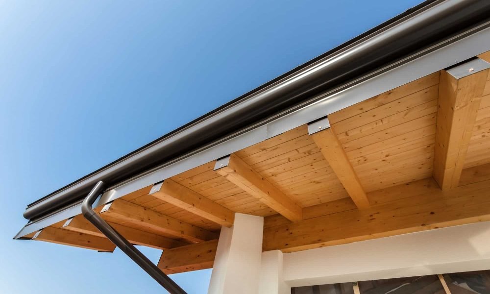 new-wooden-warm-ecological-house-roof-with-steel-gutter-rain-system.jpg